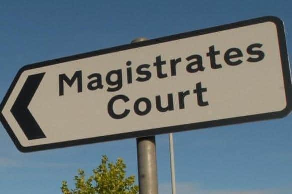 The driver headed to Northampton Magistrates Court after being stopped with seven people in a small hatchback.