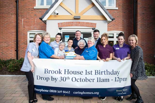 Staff and residents at Brook House Care Home in Water Lane, Towcester, celebrate its first birthday.