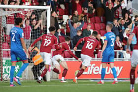Paul Lewis runs away to celebrate after scoring the Cobblers' first goal in the win over Carlisle United (Picture: Pete Norton)