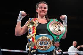 Chantelle Cameron shows off here two world titles as well as The Ring Magazine belt after her win over Mary McGee