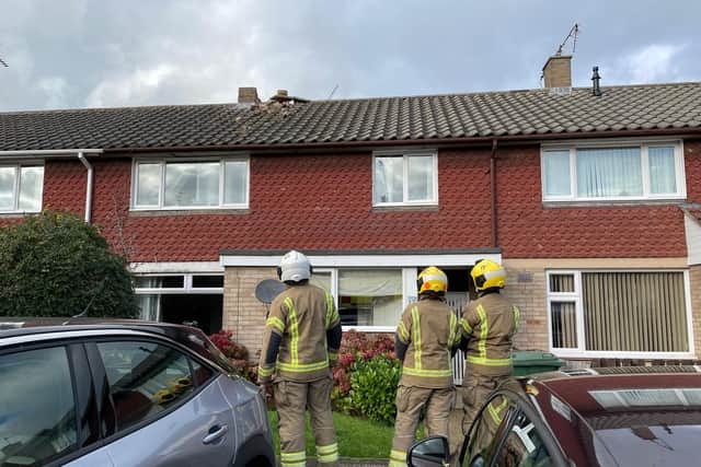 Firefighters survey some of the damage in Bingham Walk