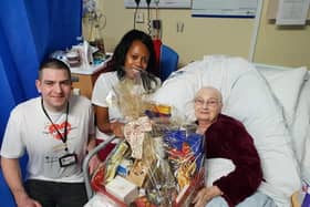 Lee and Lorraine Lewis handing out a Christmas hamper.