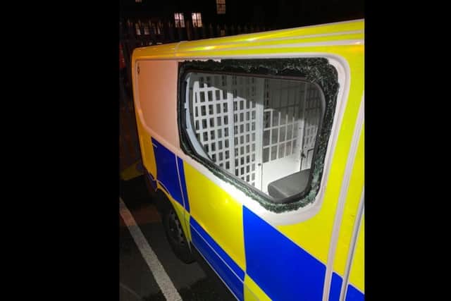 The police van's window was left smashed after an unknown offender hurled a brick at it. Photo: The Northampton Neighbourhood Policing Team