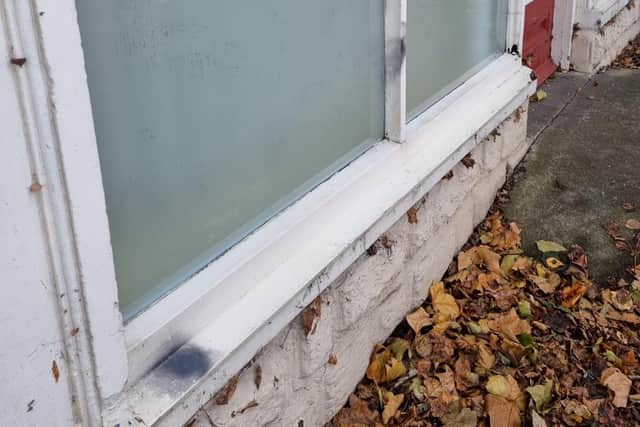 Black spraypaint can be seen on the ledge and window frame. Image: Northants Telegraph.