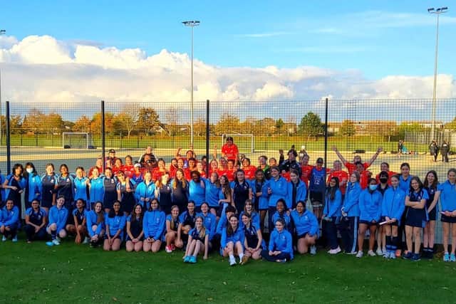 The team posed with Year 10 students who watched the training session.