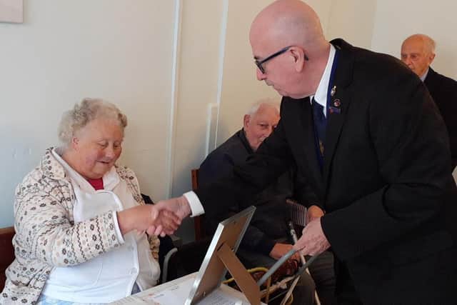 Ian Byrnes, County Chairman for the Royal British Legion, presents Aileen with her award.