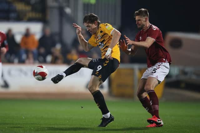 Jon Guthrie stays close to Cambridge United striker Joe Ironside (Picture: Pete Norton)