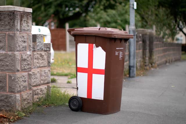 Plans to charge £42-a-year for emptying brown bins will be looked at by a council committee