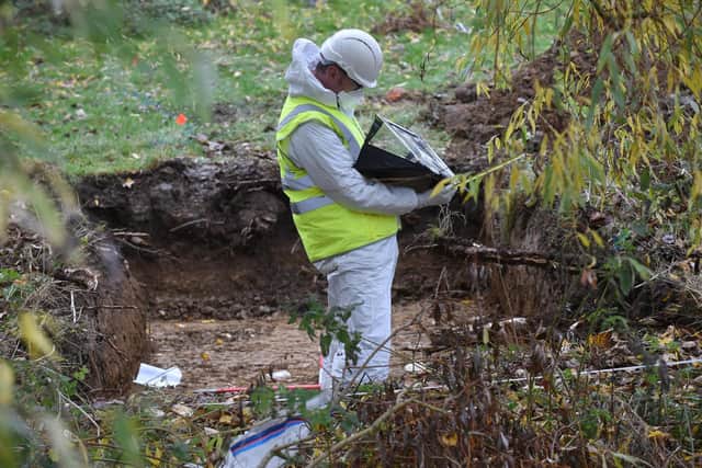 Forensics experts bag up something they've found. Picture by Andrew Carpenter