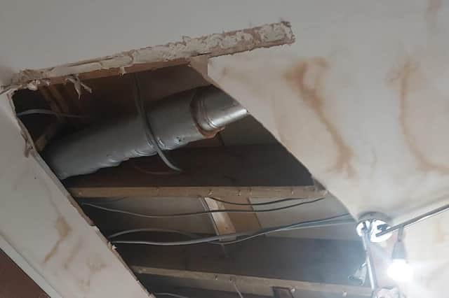 The large hole is still in the family's ceiling after weeks of waiting for repairs