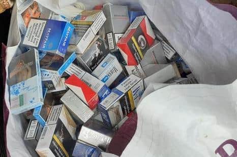 Police and customs officers seized more than 2,000 packets of cigarettes during raids in Northampton