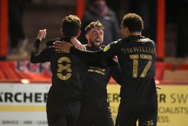 Jack Sowerby celebrates his first-half goal with Paul Lewis and Shaun McWilliams (Pictures: Pete Norton)