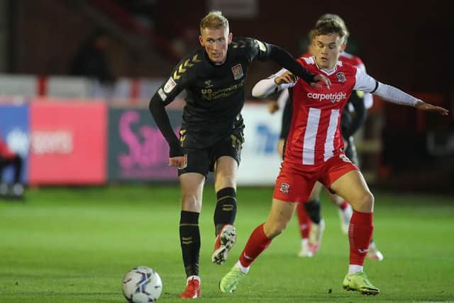 Mitch Pinnock on the ball for the Cobblers at Exeter