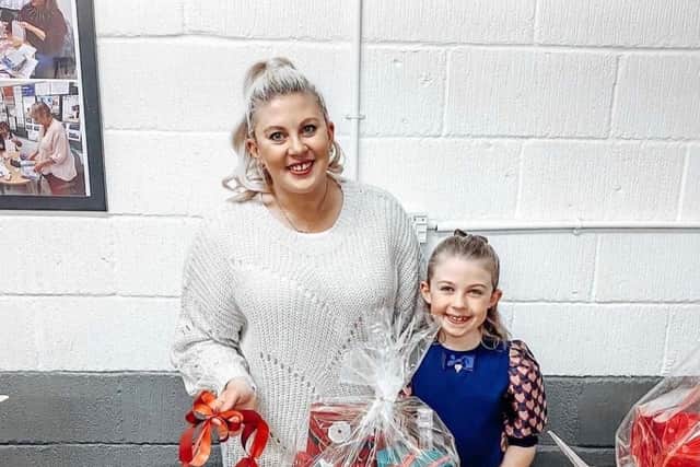 Louise Pentland and her daughter, Darcy, helping to make up hampers.