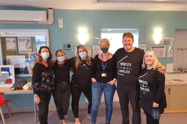 Some of the volunteers with Stewart, the founder of Haircuts for Homeless.