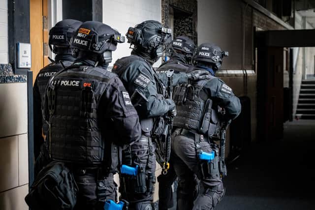 Armed police pin down the 'terrorists' during the exercise in Northampton