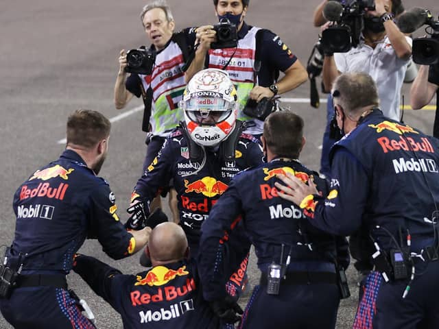 Max Verstappen celebrates with his team after the Abu Dhabi Grand Prix