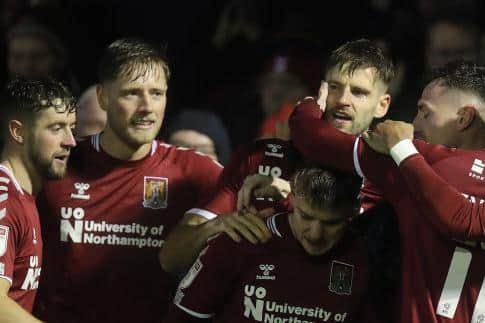 Fraser Horsfall and Jon Guthrie celebrate the latter's goal in Saturday's 2-1 win at Harrogate (Picture: Pete Norton)