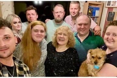 Precious family photograph: Elaine (front, third from left) with Emily Horne, Daniel Perry, John Evans and Richard Tate. 
Bottom left Adam Perry, Emma Willetts, Stephen Willetts, Jemma Evans and Buddy the dog.