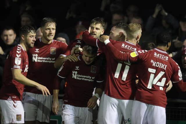 Jon Guthrie and his Town team mates celebrate the defender's winning goal at Harrogate last weekend