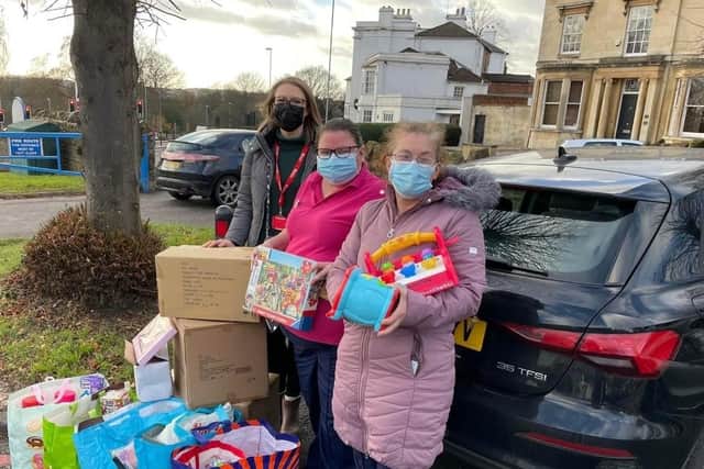 Student Ann Marie Mehdi (left) and NGH staff with the donated toys.