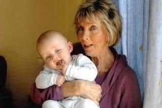 Vicky with one of her grandchildren.