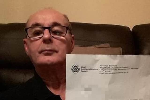 David with one of his council tax notices.