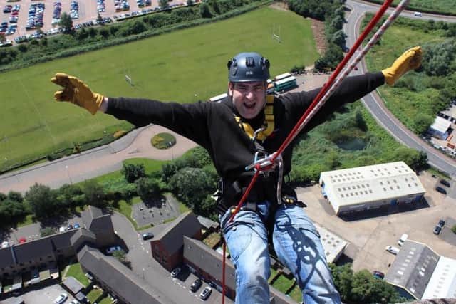 Lee Lewis abseiling last year.