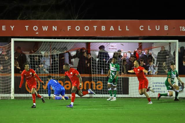 Lee Ndlovu celebrates his goal against Kettering Town as Brackley Town extended their lead at the top of the table to five points. Picture by Peter Short