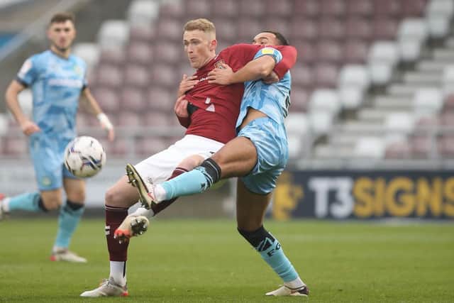 Mitch Pinnock holds off Dominic Bernard. Picture: Pete Norton.
