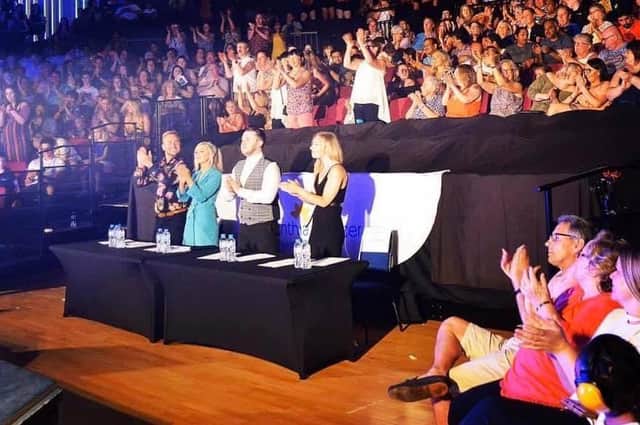 Judges applauding previous Rising Star contestants.