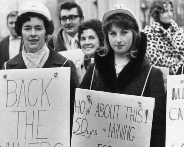 18th January 1972: Miners' wives wearing placards to complain about their husbands' pay and supporting their strike outside the Houses Of Commons in London.