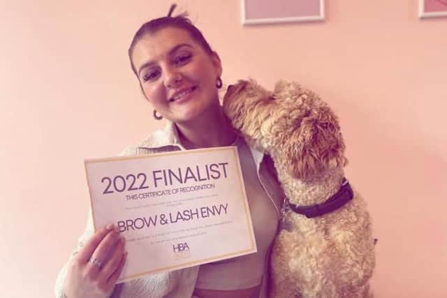 Claudia Sardi, 26, with her dog, Reggie.