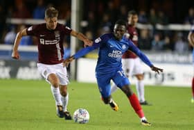 Idris Kanu tussles with Sam Foley while playing for Peterborough against the Cobblers in an EFL Trophy clash in October, 2017