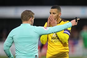 Sutton skipper Craig Eastmond looks shocked as he is sent off by referee John Busby at Gander Green Lane on Saturday (Picture: Pete Norton)