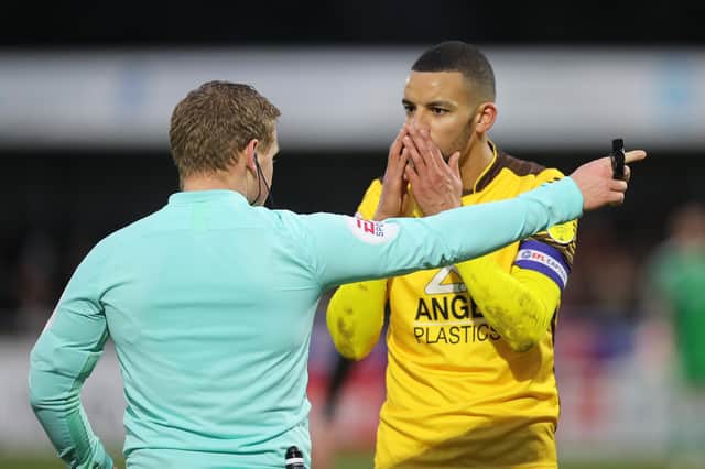 Sutton skipper Craig Eastmond looks shocked as he is sent off by referee John Busby at Gander Green Lane on Saturday (Picture: Pete Norton)