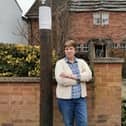 Linda Calvey next to the new pole outside her home in Park Lane, Duston