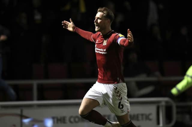Cobblers skipper Fraser Horsfall runs away to celebrate after scoring the Cobblers' winner against Newport County at Sixfields (Picture: Pete Norton)
