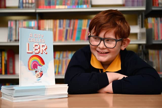 Samuel Debenham with his published book.