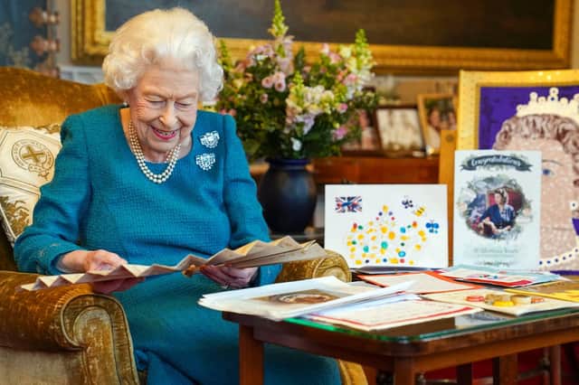 The Queen with some of the many messages from well-wishers