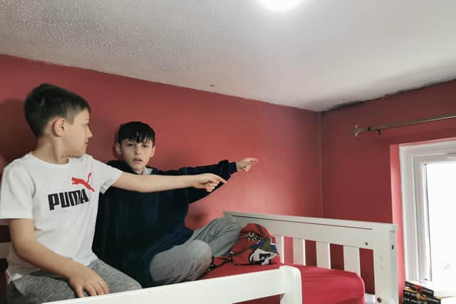 All three of Rhianne's sons sleep in the same room which is affected by damp and mould