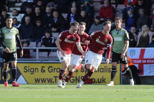 Fraser Horsfall celebrates after scoring the Cobblers' first goal against Colchester United at Sixfields on Saturday (Picture: Pete Norton)