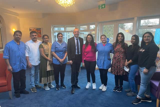 Holly House residential home staff pictured with MP Chris Heaton-Harris