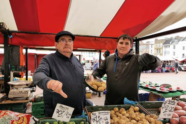 Fitzy and his son at their stall in the Market Square. Photo: Logan MacLeod