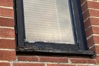 The resident does not dare to touch her landing window for fear it will fall out.