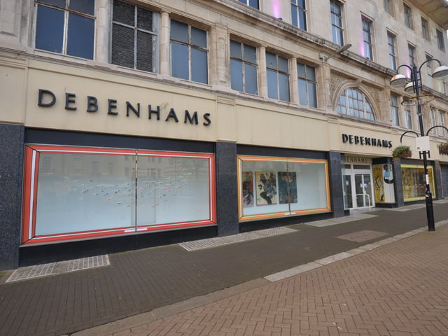 Artwork in the windows of the old Debenhams store in Hastings. SUS-220224-134137001
