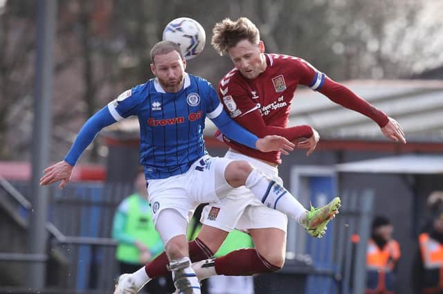 Fraser Horsfall goes up for an aerial challenge with Rochdale's Matty Done. Picture: Pete Norton.