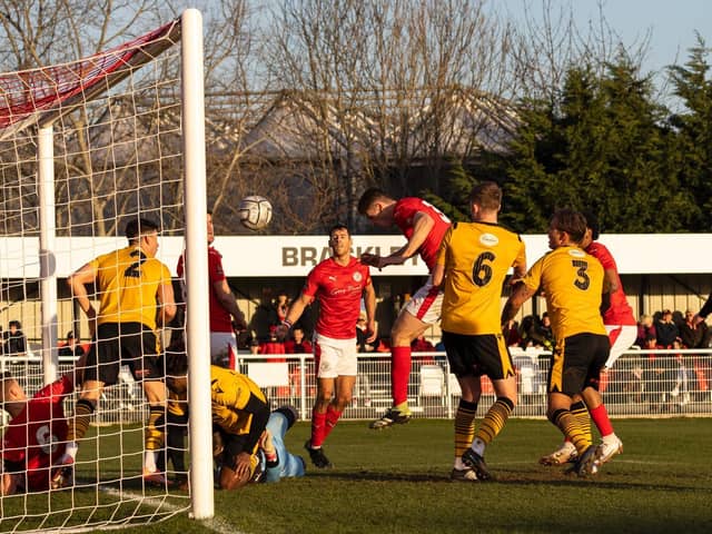 Max Dyche heads home Brackley Town's third goal in their 3-0 win over Bradford (Park Avenue) at St James Park. Picture by Glenn Alcock