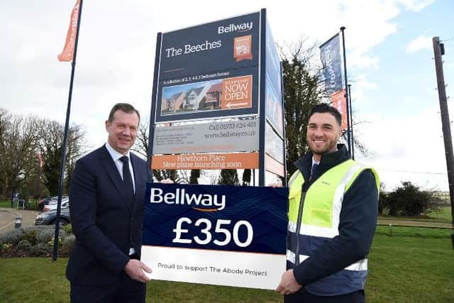 Managing Director of Bellway Northern Home Counties, Paul Smits, with Site Manager Ross Jenkins, holding the £350 cheque donated by the division
