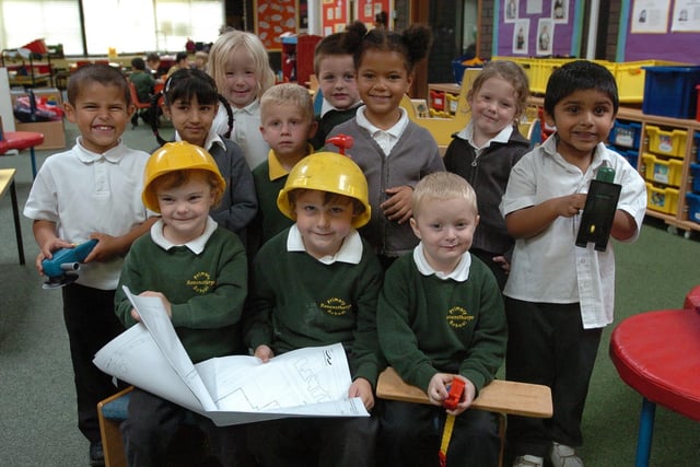 Ravensthorpe Primary School, Brigstock Court, getting a new children's centre, reception youngsters with hard hat, plans and tools, (front seated L-R) Chloe (4) Lewis (5) Robbie (4)